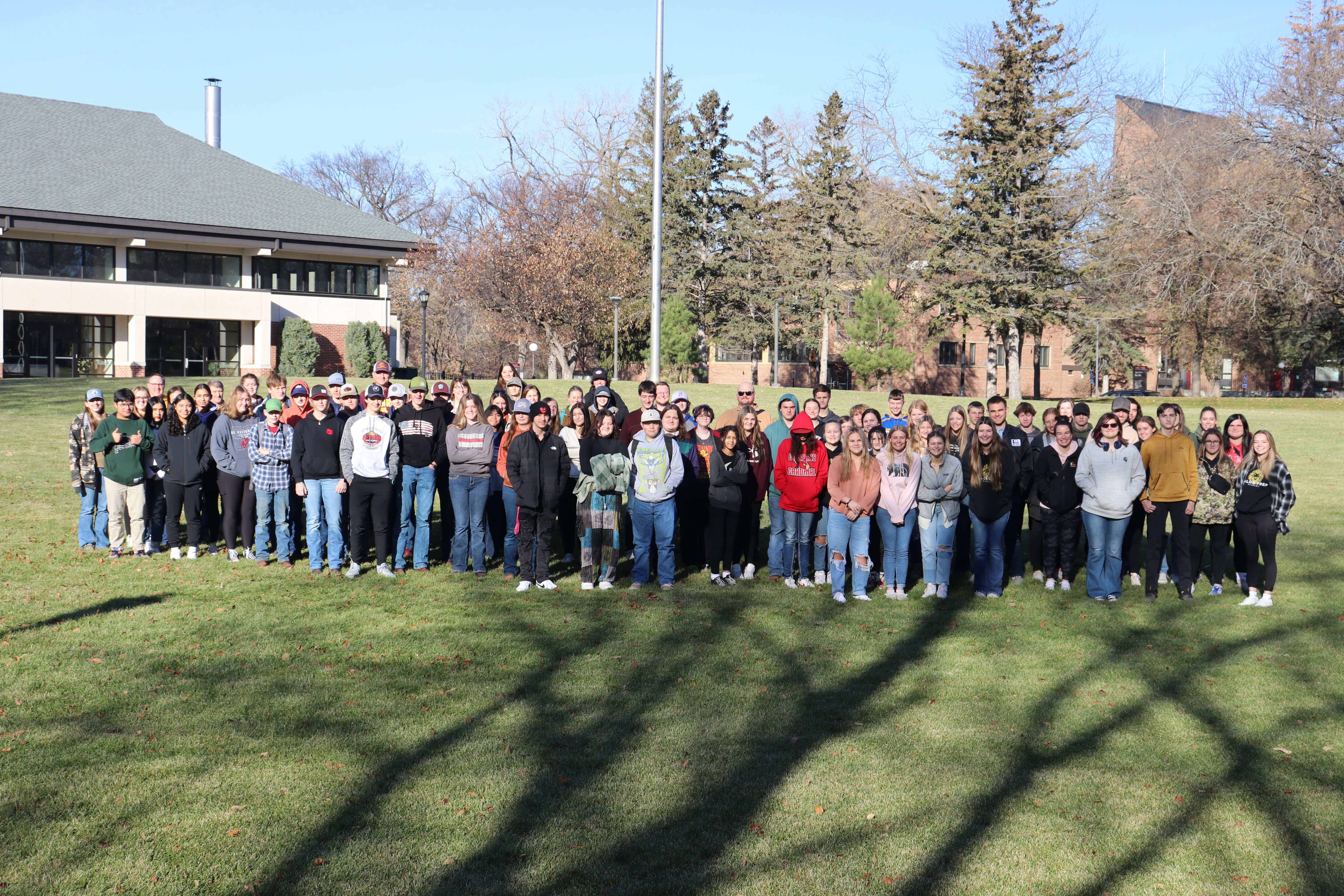A group of high school students gathered on the mall of the UMN Morris campus