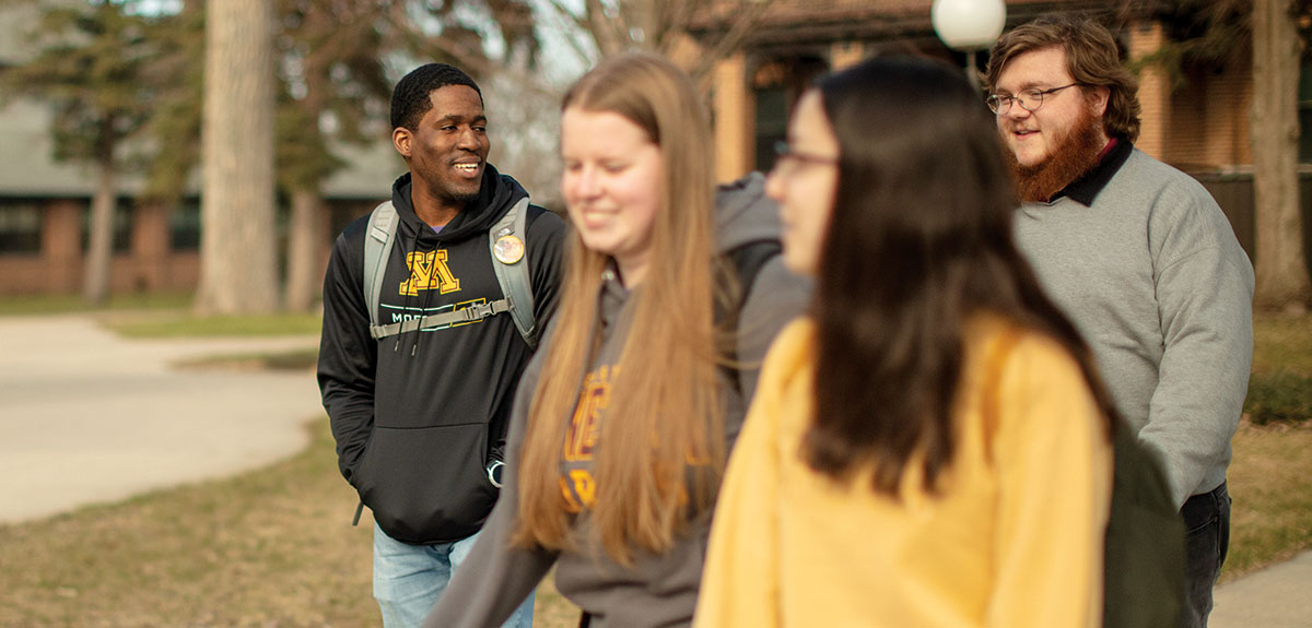 A group of students tours campus