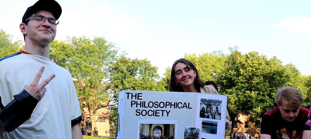 Students at the fall activities fair recruit members for the philosophical society.