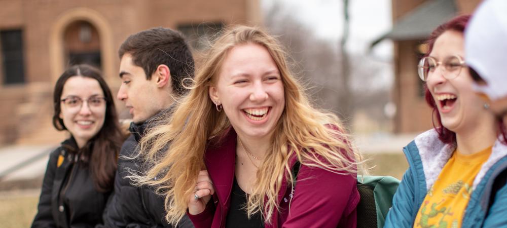 Students laughing together on campus