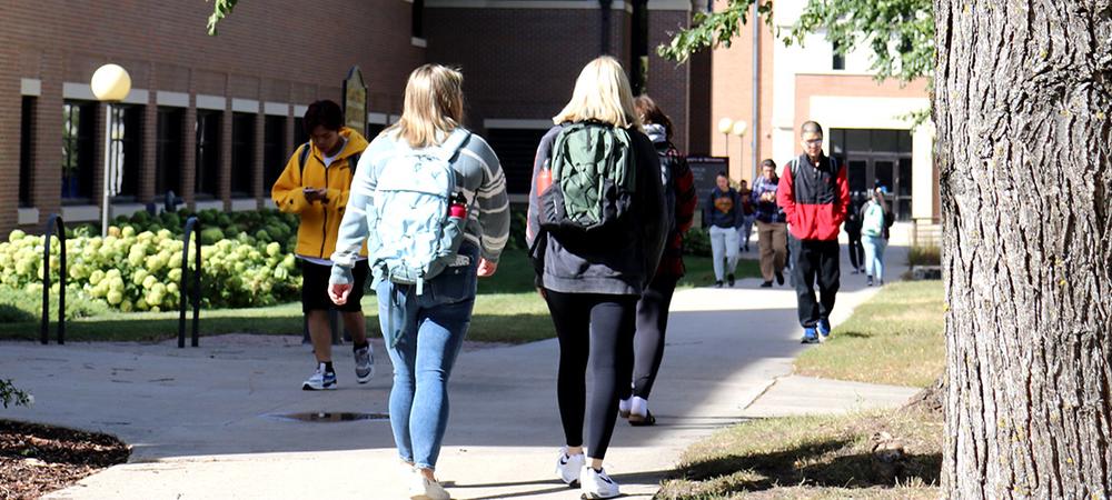 Students walk to class in the Science Building on a sunny fall afternoon.