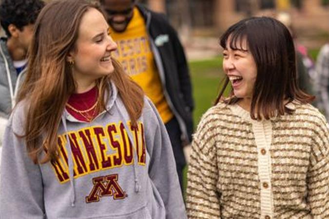 Students looking at each other and smiling