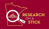 A logo that includes an outline of the state of Minnesota, a magnifying lens, and the words, Research on a Stick, D2D