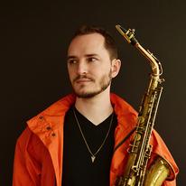 Remy Le Bouef holding a saxophone
