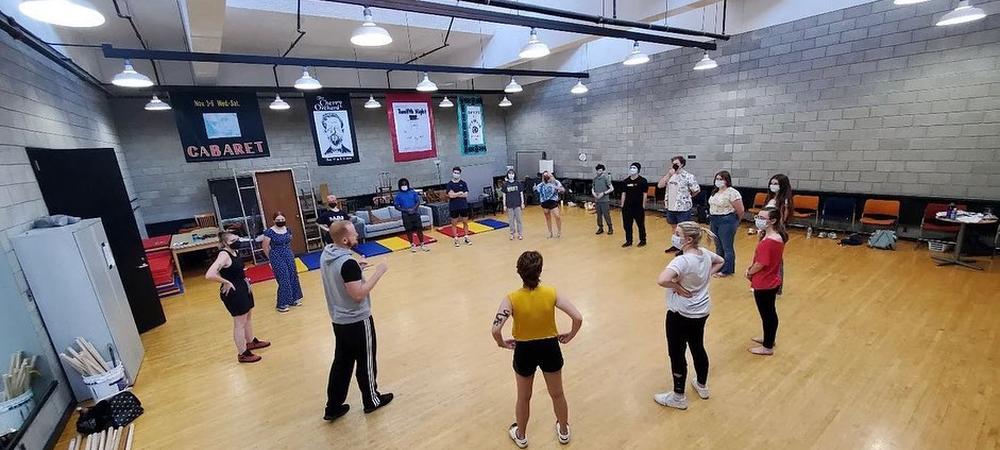 Group of people working together in a rehearsal space