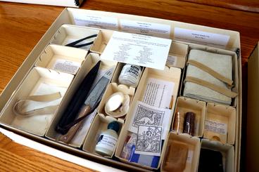 display box showing a variety of paleography materials
