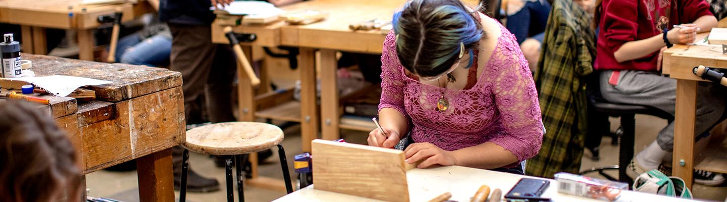 studio art class works on relief-carving wood