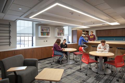 Several students work in a collaborative space in the teacher education area of Blakely Hall.