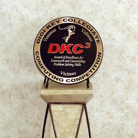 A round plaque that reads, "Digi-Key Collegiate Computing Competition DKC to the third power" 